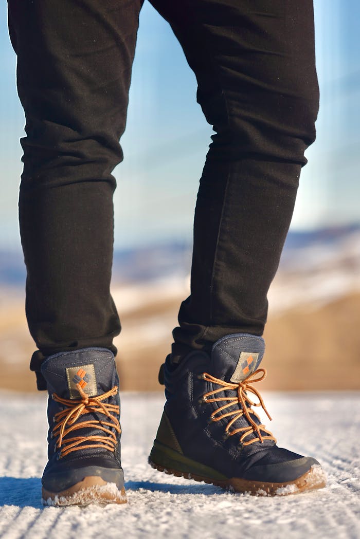 Close-up of winter boots showcasing fashion and practicality in snowy Qusar, Azerbaijan.